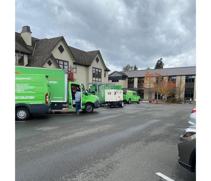 SERVPRO vehicles at water damage cleanup site