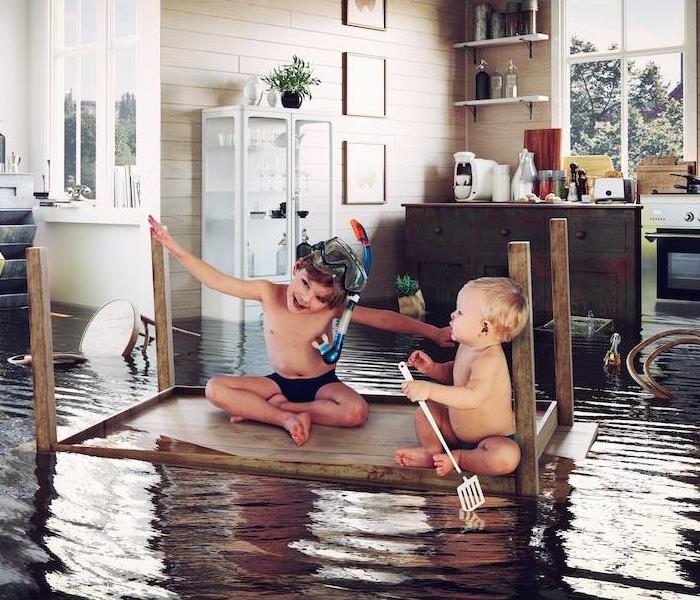 kids play on the table while flooding in the kitchen