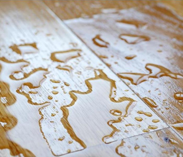 Water drops on wooden surface